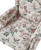 Sillón acentuado tapizado Matteo Floral con adornos de cabeza de clavo